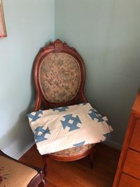 2 of  two Eastlake chairs, and an antique quilt.
