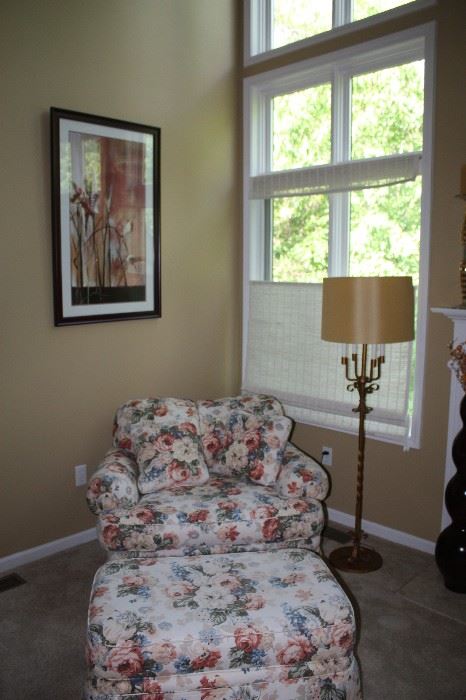 Flowered Chair & matching ottoman. large sitting area with matching small pillows. 
