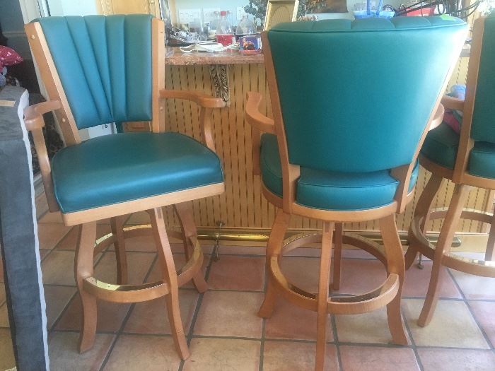 There are 3 high-back swivel bar stools and 1 matching swivel stool with no back, all in excellent condition.