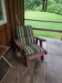 One of two red wood chairs