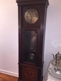 fantastic antique grandfather clock that keeps perfect time