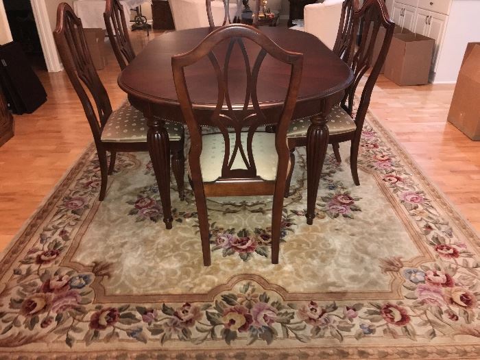 Beautiful area rug and Stanley dining room table 