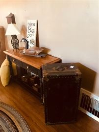 Steamer trunk, wooden buffet table, cast iron lamp, resin goose