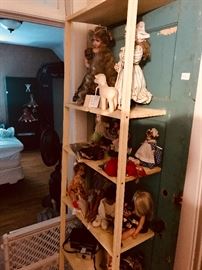 Vintage dolls on antique door shelf