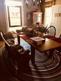 9ft (with2 leaves) dinning room table, secretary desk, curved church pew, braided rug