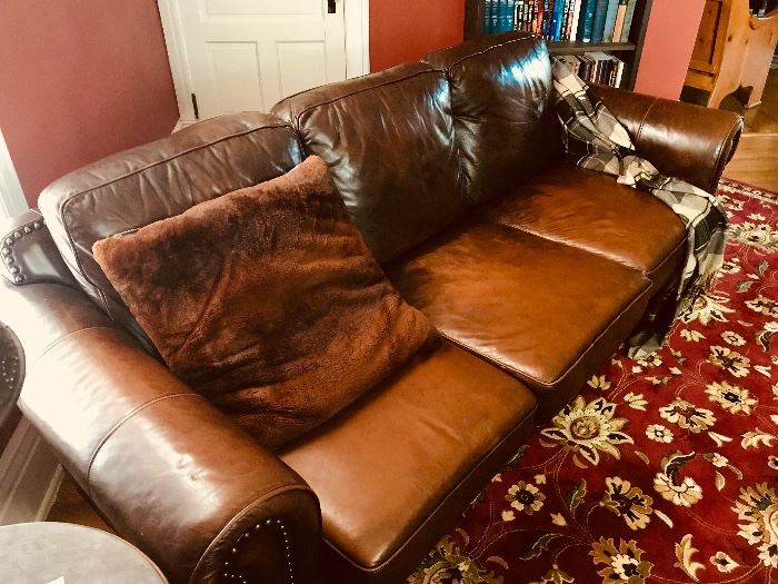 Leather sofa and large Persian rug