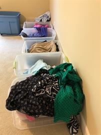 Assorted bins of clothes
