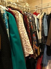 Many closets full of clothing much in petite up to larger sizes.