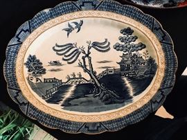 Real Old Willow Blue by BOOTHS. 15" platter. On replacements.com it is selling for $169.95. Estate sale price: $40 (stains, crackled, older)