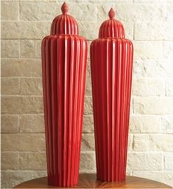 These extra large lidded red fluted jars are worth between $550 - $750 each.  Over 4 feet tall!
http://www.shopcandelabra.com/global-views-fluted-temple-jar-red.. 
We have them for sale at this estate sale for $250 each! 
2"Dia. x 48.5"H