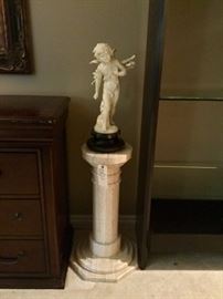 Antique cupid sculpture and marble stand