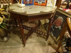 Antique octogon tea table w/glass and wheels