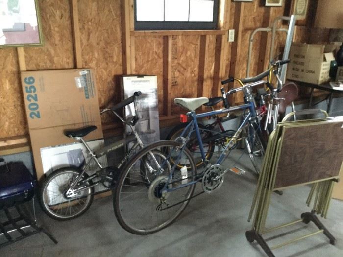 vintage bicycles, tv trays, unopened bathroom cabinet goes over toilet, in box swivel TV stand