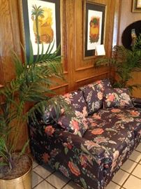 Floral loveseat from the Circle Gallery in New Orleans; matching palms in brass planters
