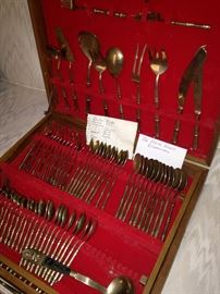 Brass flatware in case