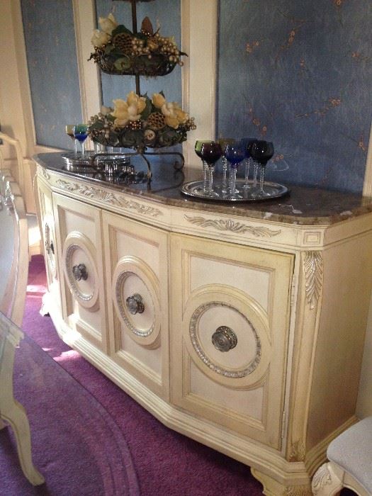 The stunning buffet matches the table and china cabinets.