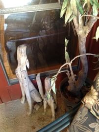 Howling coyotes made of driftwood