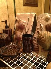 Fish and shell plaques; brown woven vanity set