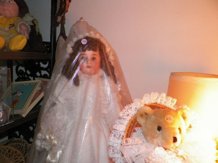 Our Great Grandmother's doll, fully restored wearing a wedding gown that was made by our Mom