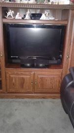 Flat screen tv and entertainment center, and ENESCO collectibles