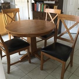 $175 Round table with extra leaf and four chairs