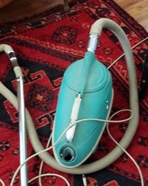 vintage turquoise vacuum with chest included