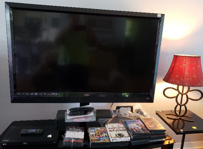 large screen television, DVD's, stand