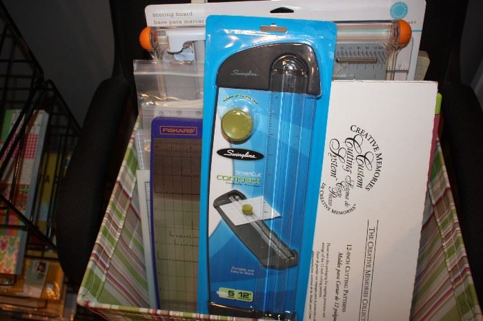 Many new in box paper cutters