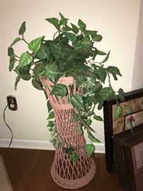 Wicker plant stand with artificial ivy plant