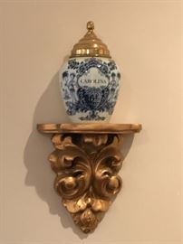 Holland 'Delft' canister; Gold wall shelf
