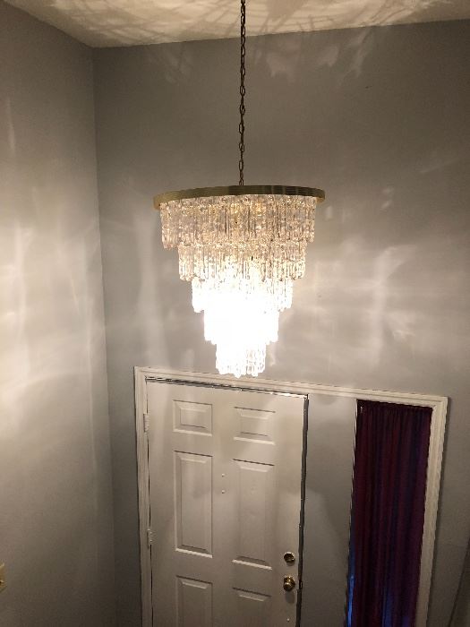 Plexiglass chandelier in entry way