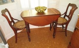 Antique drop leaf table, 2 cane seat chairs