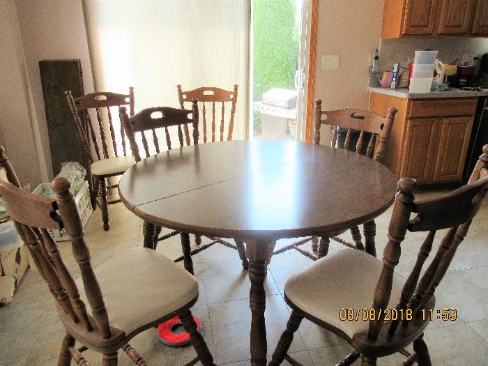 kitchen table with 6 chairs and 2 extensions