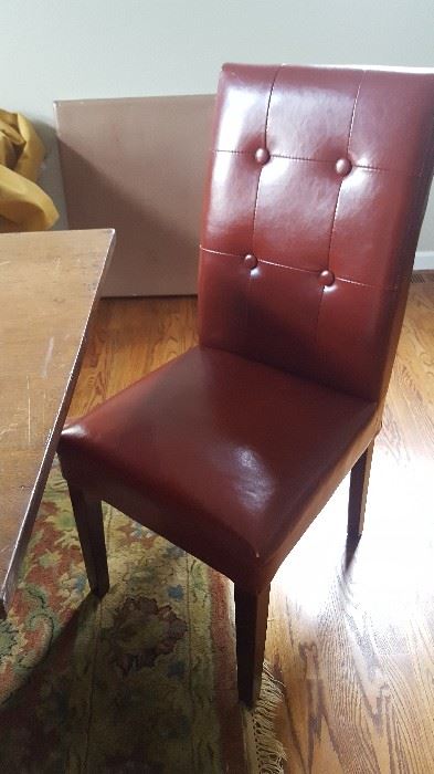 4 orange leather chairs