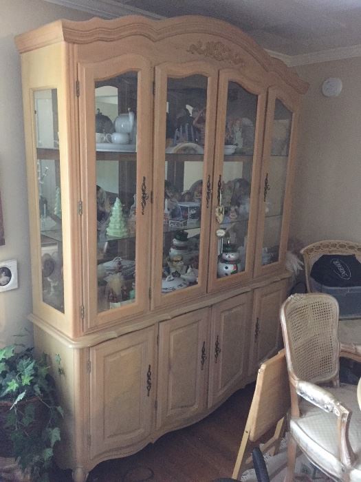 French provincial style lighted china cabinet. Two pieces. Originally purchased from Wicke's furniture in 1995.