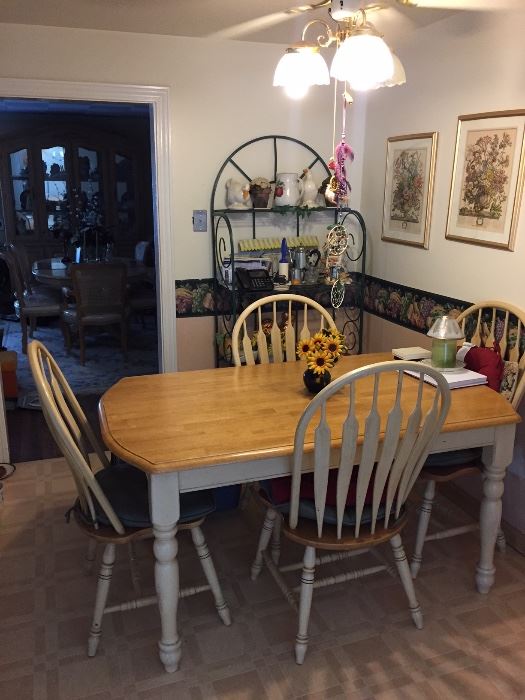 Farmhouse style kitchen table with four matching chairs. Good condition.