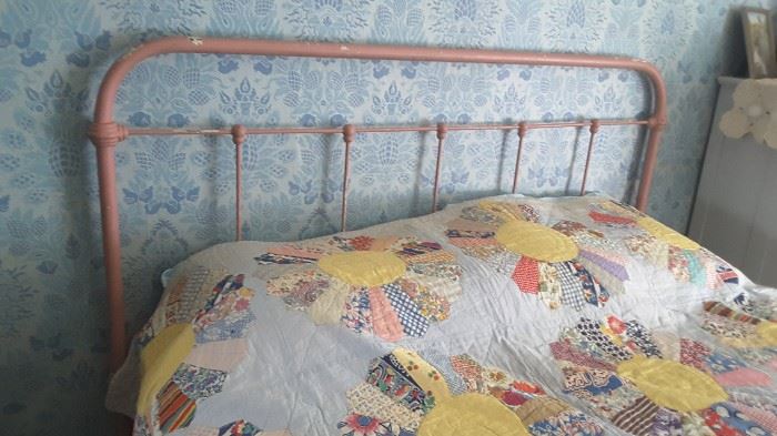 Pink iron bed and quilt