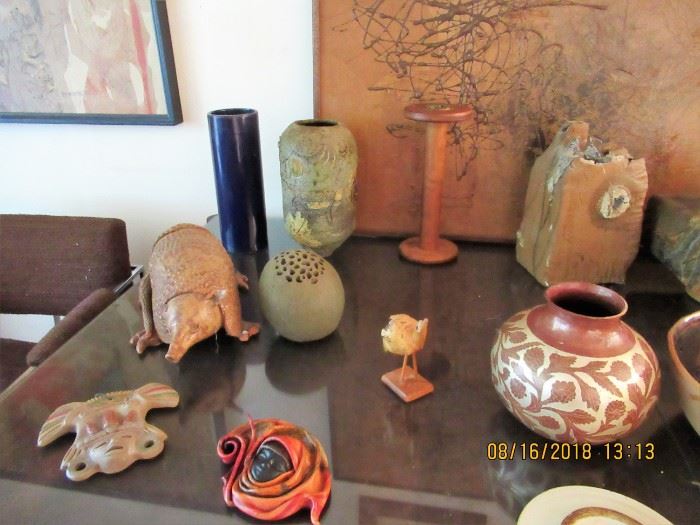 a wide selection of art pottery vases and dishwares