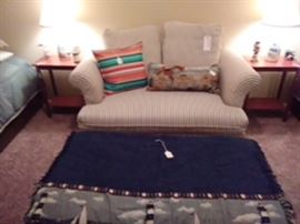 Sleeper loveseat and storage ottoman