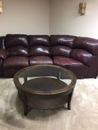 Round coffee table and sectional couch - leather