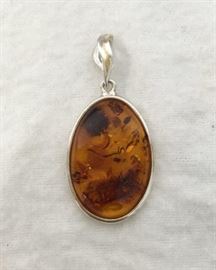Sterling Silver Pendant with Baltic Amber       http://www.ctonlineauctions.com/detail.asp?id=748076