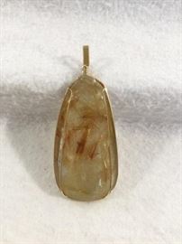  Rutilated Quartz and Gold Pendant  http://www.ctonlineauctions.com/detail.asp?id=748079