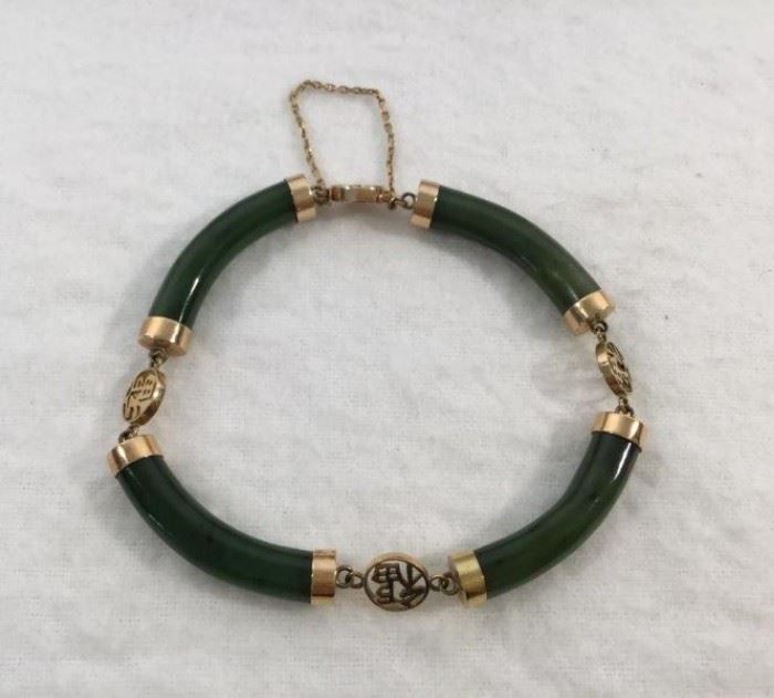 14 Karat Yellow Gold and Jade Bracelet          http://www.ctonlineauctions.com/detail.asp?id=748078