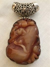 Sterling Silver Pendant with Red Jade  http://www.ctonlineauctions.com/detail.asp?id=748110