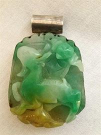 Silver Pendant with Green Jade  http://www.ctonlineauctions.com/detail.asp?id=748112