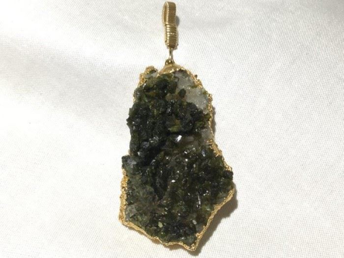 Dark Crystal Pendant with 10KT Gold Setting http://www.ctonlineauctions.com/detail.asp?id=748149