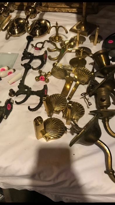 Several sets of brass towel racks and hooks