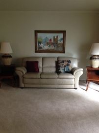 Beautiful leather couch! Flanked by solid Maple matching step tables. There is also a matching coffee table!