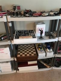 Danbury mint models on top. History channel Civil War Chess Set next to a Donald Trump statue. Below that is a History Channel Game Set with some additional Danbury Mint models!