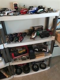 More models from Danbury Mint and the Hamilton Collection of John Wayne pickups. Bottom shelf has tire advertising ashtrays.